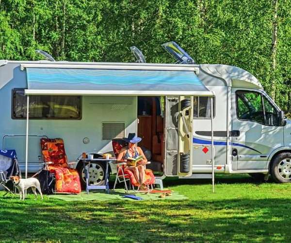 photo of a woman relaxing RV Travel During Covid-19