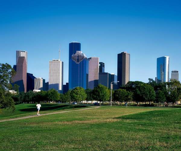 photo of downtown Houston view from park to ship a car